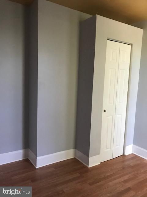 interior space with dark wood-type flooring