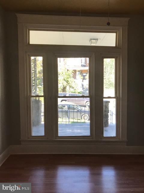 entryway featuring dark wood-type flooring