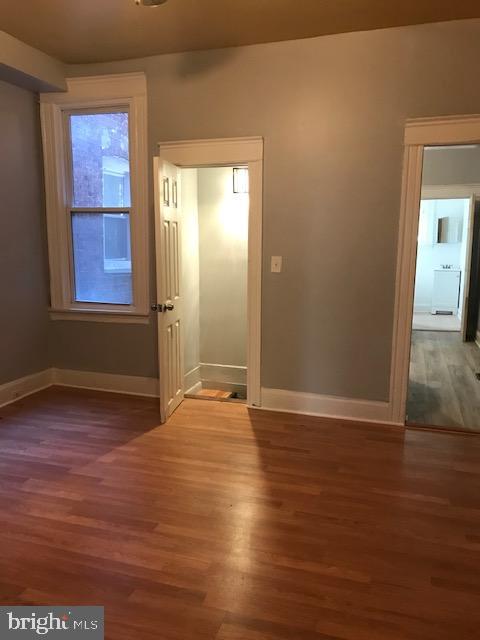 unfurnished room featuring hardwood / wood-style floors