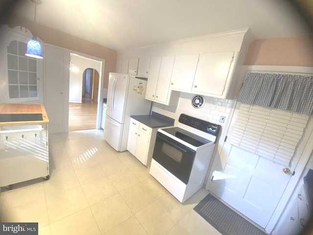 kitchen with white cabinetry, light tile patterned floors, backsplash, and white appliances