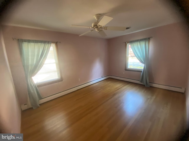 spare room with light hardwood / wood-style flooring and ceiling fan