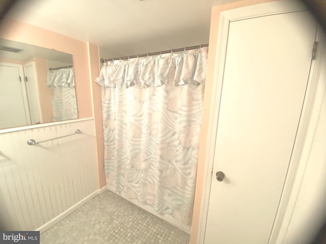 bathroom with tile patterned floors and a shower with curtain