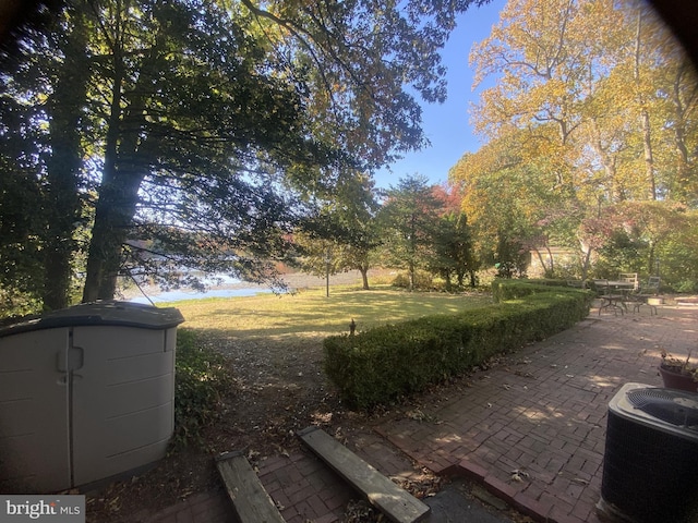 view of yard with a patio and cooling unit