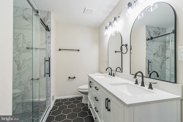 bathroom with tile patterned flooring, an enclosed shower, and toilet