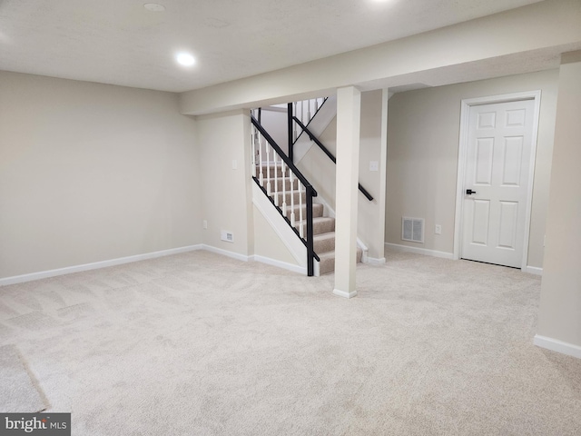 basement with light colored carpet