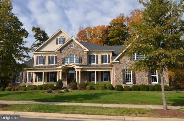 craftsman-style home with a front lawn