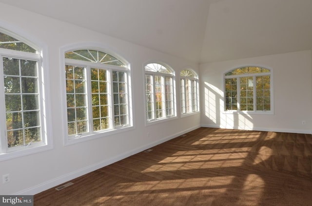 unfurnished sunroom with lofted ceiling and a healthy amount of sunlight