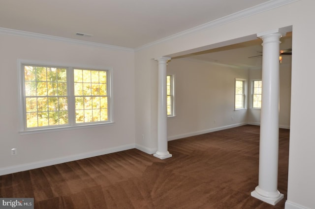 carpeted spare room with crown molding and a wealth of natural light