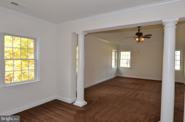 carpeted empty room featuring crown molding and a wealth of natural light