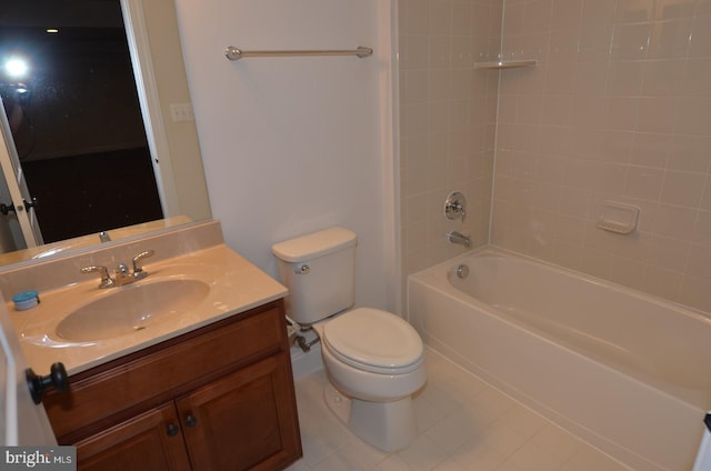 full bathroom featuring vanity, tiled shower / bath combo, toilet, and tile patterned floors