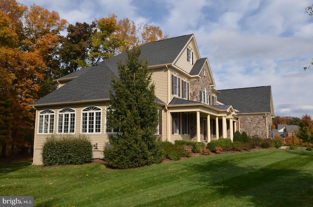 view of property exterior with a lawn