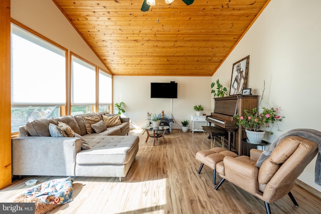 living room featuring lofted ceiling, light hardwood / wood-style flooring, ceiling fan, and wooden ceiling