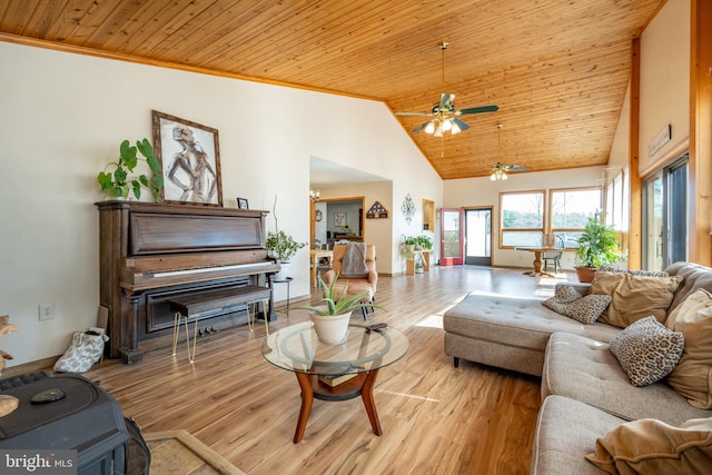 living room featuring wooden ceiling, ornamental molding, light wood-type flooring, high vaulted ceiling, and ceiling fan