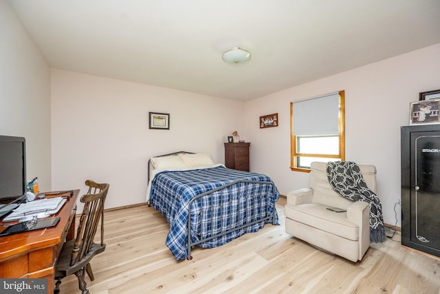 bedroom with light wood-type flooring