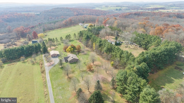 birds eye view of property with a rural view