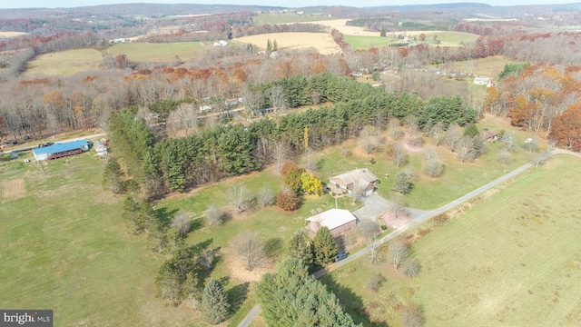 birds eye view of property with a rural view