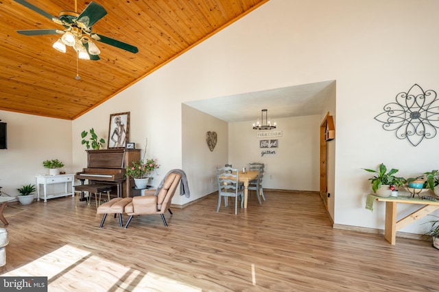 dining room featuring high vaulted ceiling, ceiling fan with notable chandelier, light hardwood / wood-style floors, and wooden ceiling