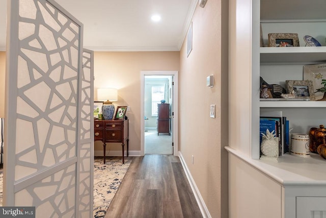 hall featuring hardwood / wood-style flooring and ornamental molding