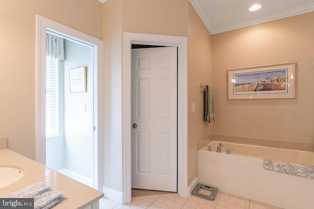 bathroom featuring ornamental molding, tile patterned floors, a healthy amount of sunlight, and a washtub