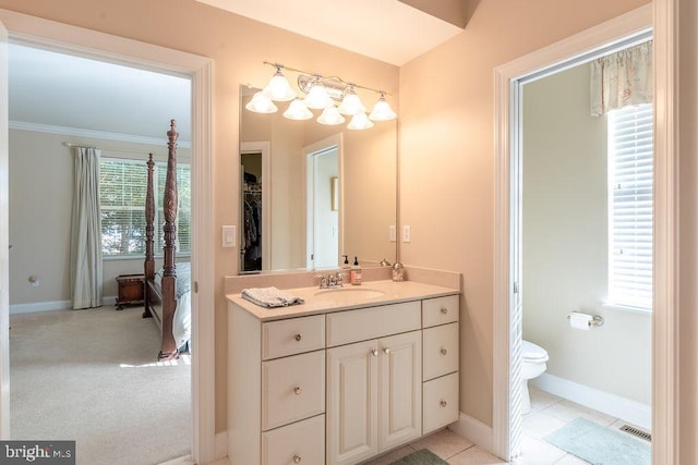 bathroom featuring vanity, toilet, and tile patterned flooring