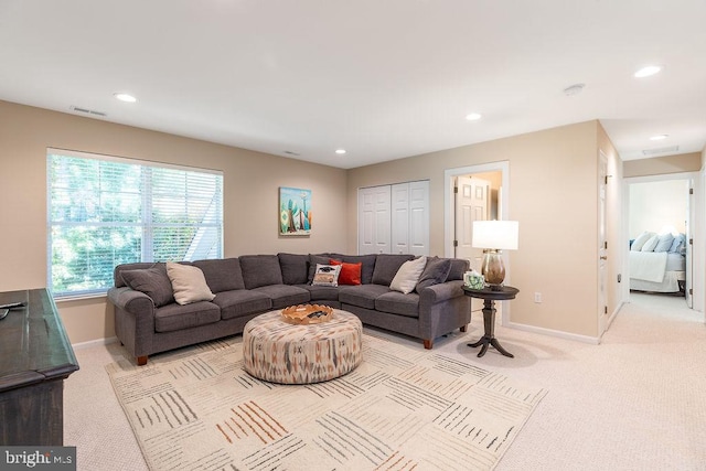 living room featuring light colored carpet