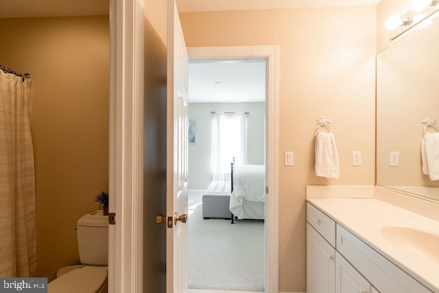 bathroom with vanity and toilet