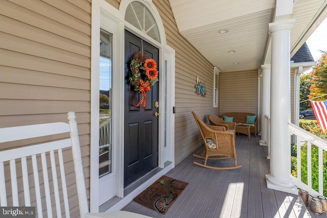 entrance to property featuring a porch