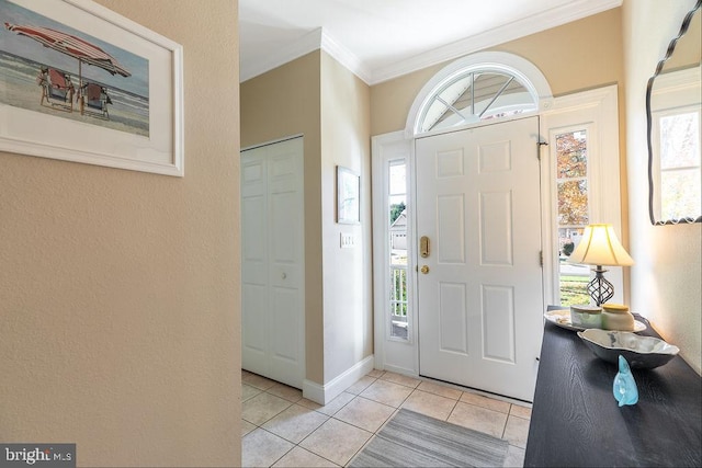 tiled entryway with ornamental molding