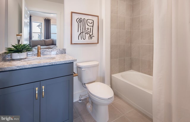 full bathroom featuring toilet, shower / tub combo with curtain, vanity, and tile patterned flooring