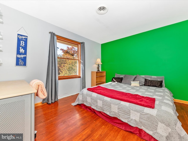 bedroom featuring hardwood / wood-style flooring