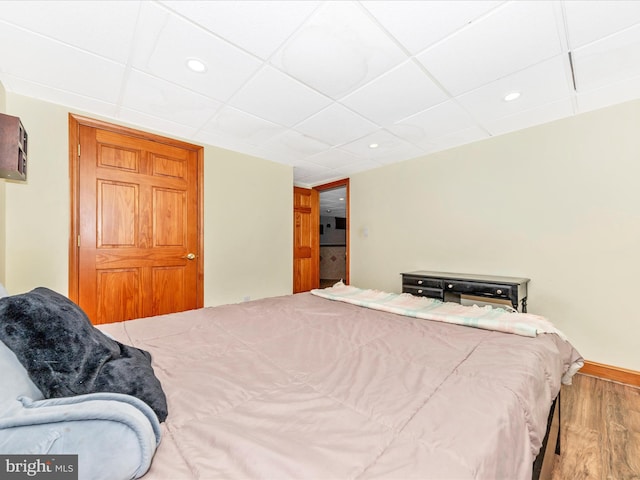 bedroom with wood-type flooring