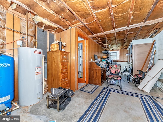 basement with wooden walls and water heater