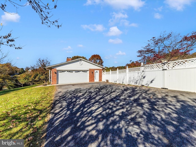 view of front facade with a front yard and a garage