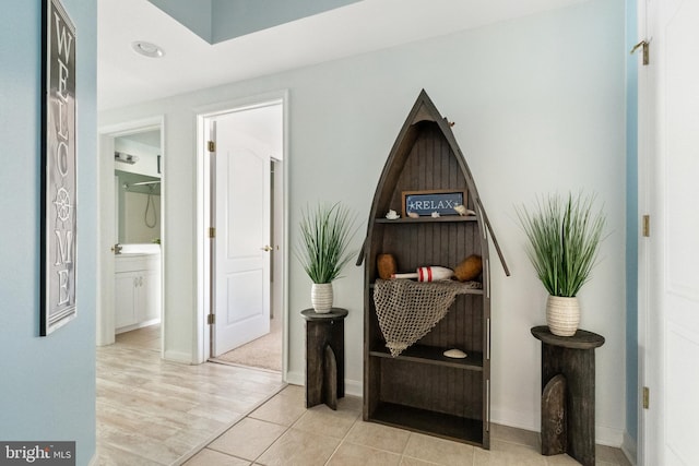 hall with light hardwood / wood-style flooring