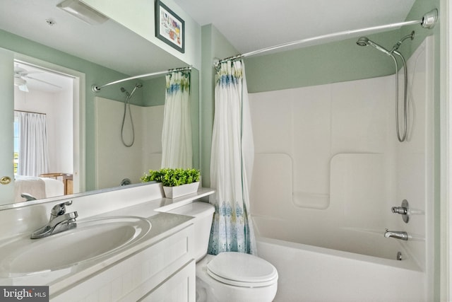 full bathroom with vanity, toilet, shower / bathtub combination with curtain, and ceiling fan