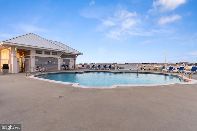 view of swimming pool featuring a patio area