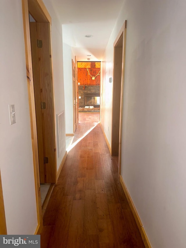 corridor featuring hardwood / wood-style floors