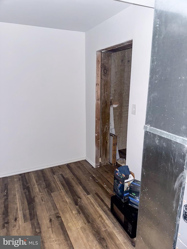 spare room featuring hardwood / wood-style floors