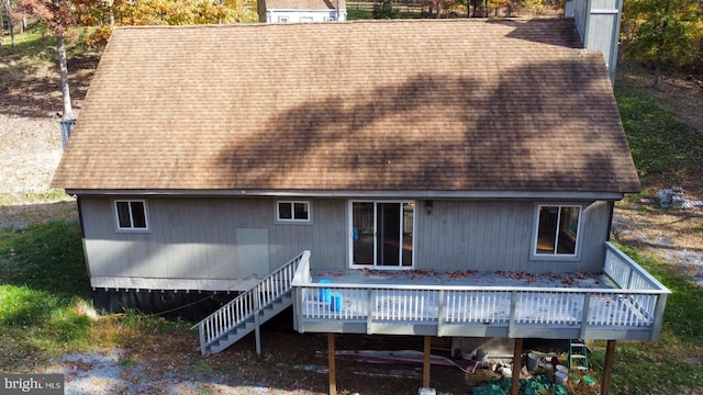 back of property featuring a wooden deck