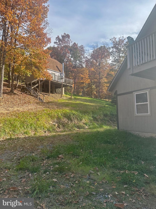 view of yard featuring a wooden deck