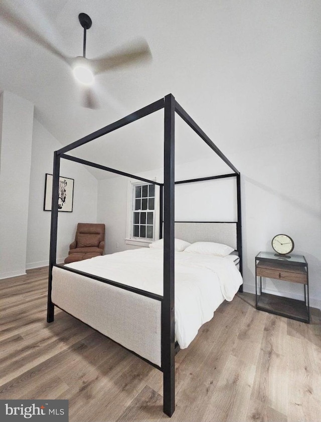 bedroom featuring ceiling fan and wood-type flooring