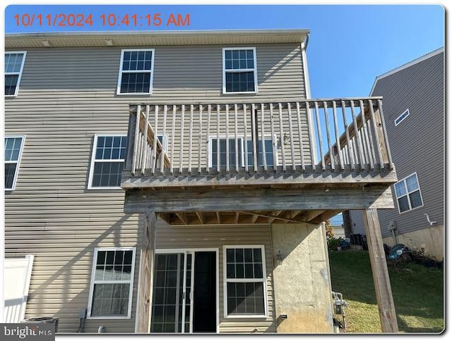 rear view of house with a balcony