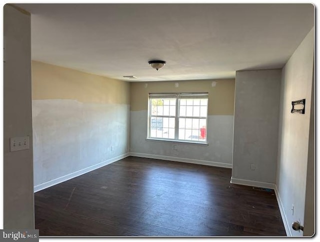 empty room featuring dark hardwood / wood-style floors