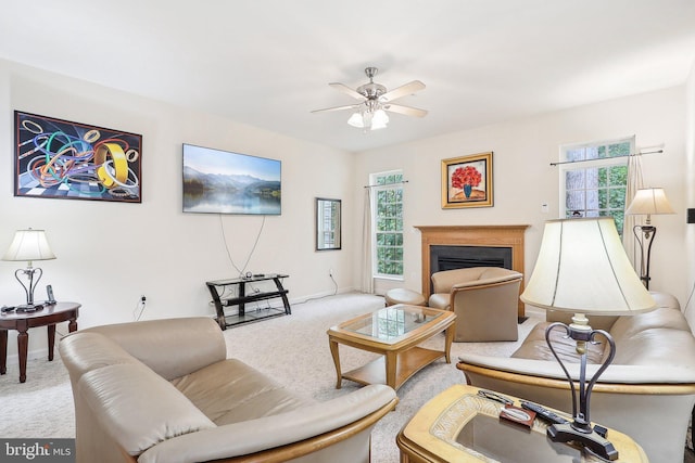 15303 Glastonbury Way, Upper Marlboro, MD 20774 - carpeted living area with healthy amount of natural light, a ceiling fan, a fireplace, and baseboards