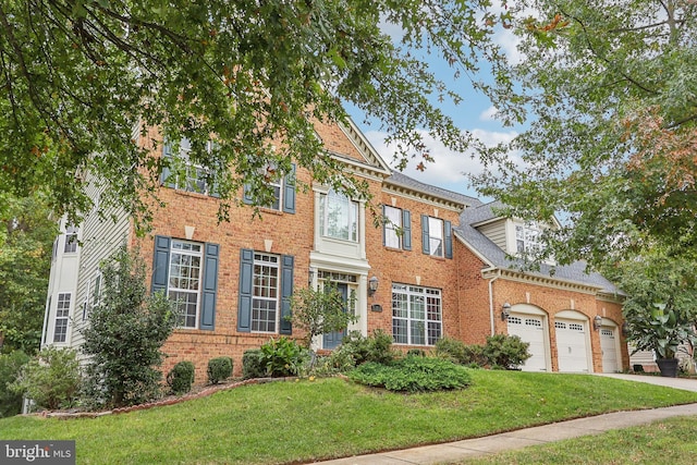 15303 Glastonbury Way, Upper Marlboro, MD 20774 - colonial inspired home featuring brick siding, a front yard, and concrete driveway