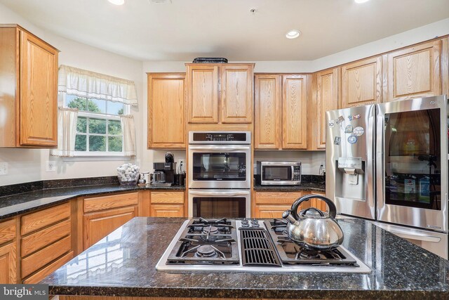 15303 Glastonbury Way, Upper Marlboro, MD 20774 - kitchen featuring stainless steel appliances, a center island, recessed lighting, and dark stone countertops
