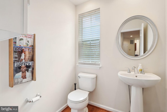 15303 Glastonbury Way, Upper Marlboro, MD 20774 - bathroom with toilet, baseboards, wood finished floors, and a sink