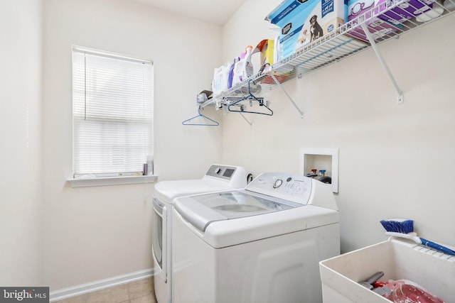 15303 Glastonbury Way, Upper Marlboro, MD 20774 - washroom with washing machine and dryer, baseboards, and light tile patterned floors