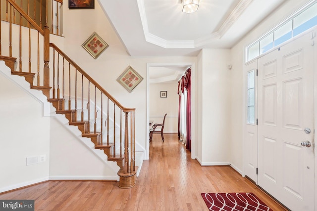 15303 Glastonbury Way, Upper Marlboro, MD 20774 - foyer entrance featuring wood-type flooring, a tray ceiling, stairway, ornamental molding, and baseboards