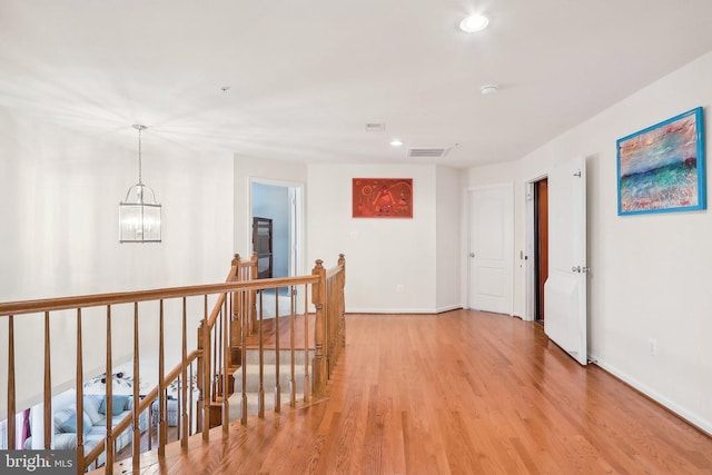 15303 Glastonbury Way, Upper Marlboro, MD 20774 - corridor featuring an upstairs landing, baseboards, a chandelier, light wood finished floors, and recessed lighting